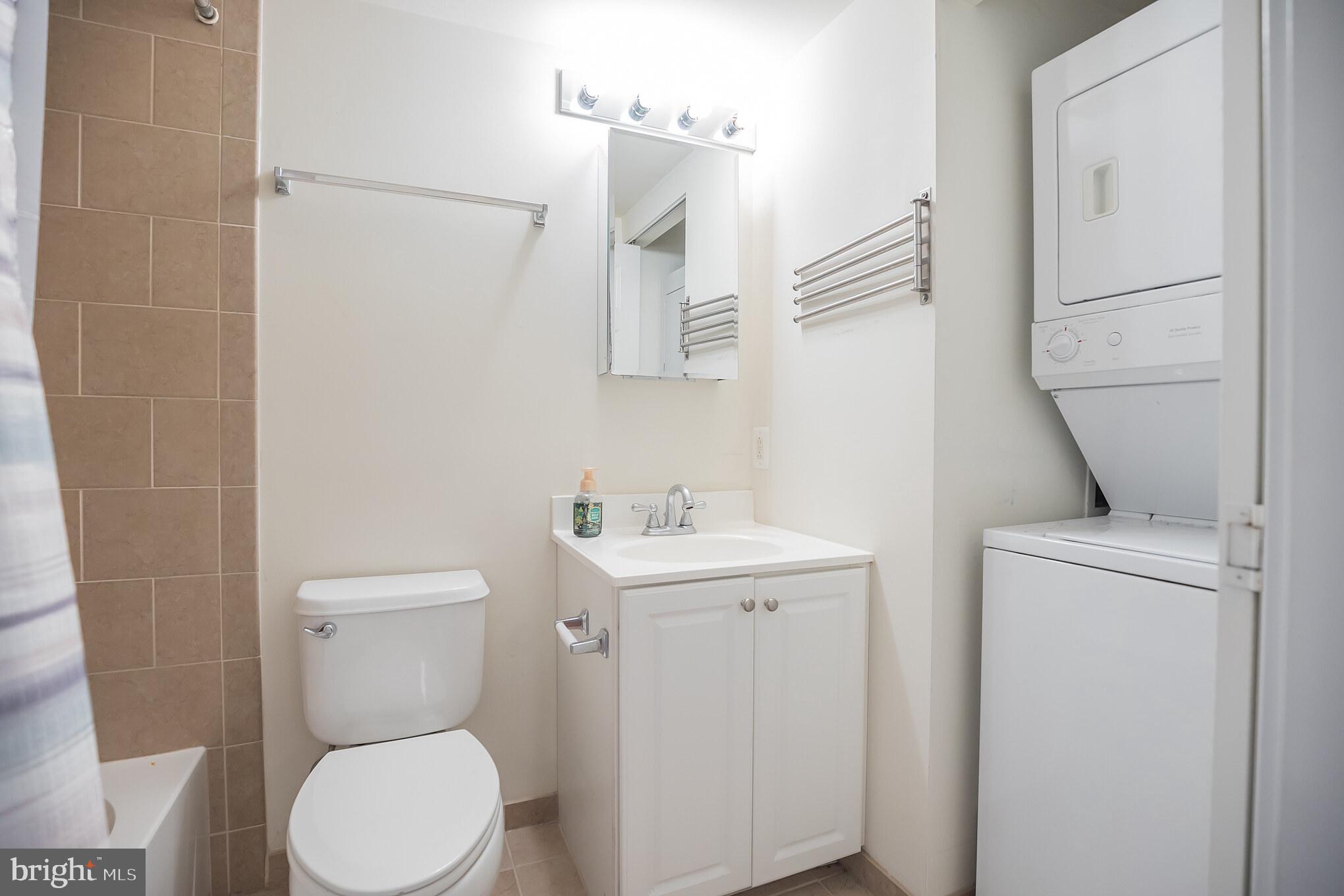 1 Academy Circle, Unit 204 Philadelphia, PA 19146 - Photo 11 of 26 Compact bathroom with laundry nook.
