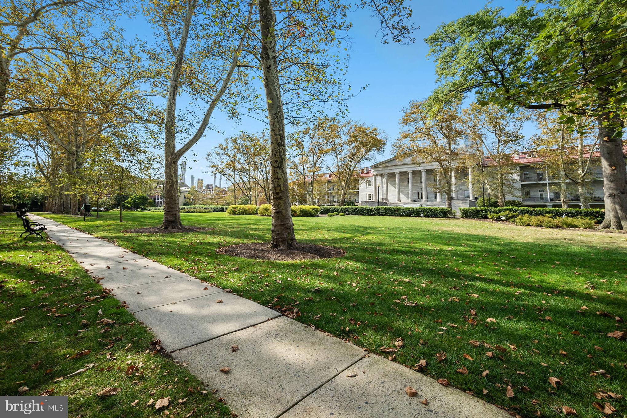 1 Academy Circle, Unit 204 Philadelphia, PA 19146 - Photo 2 of 26 Lush greenery surrounds elegant architecture.