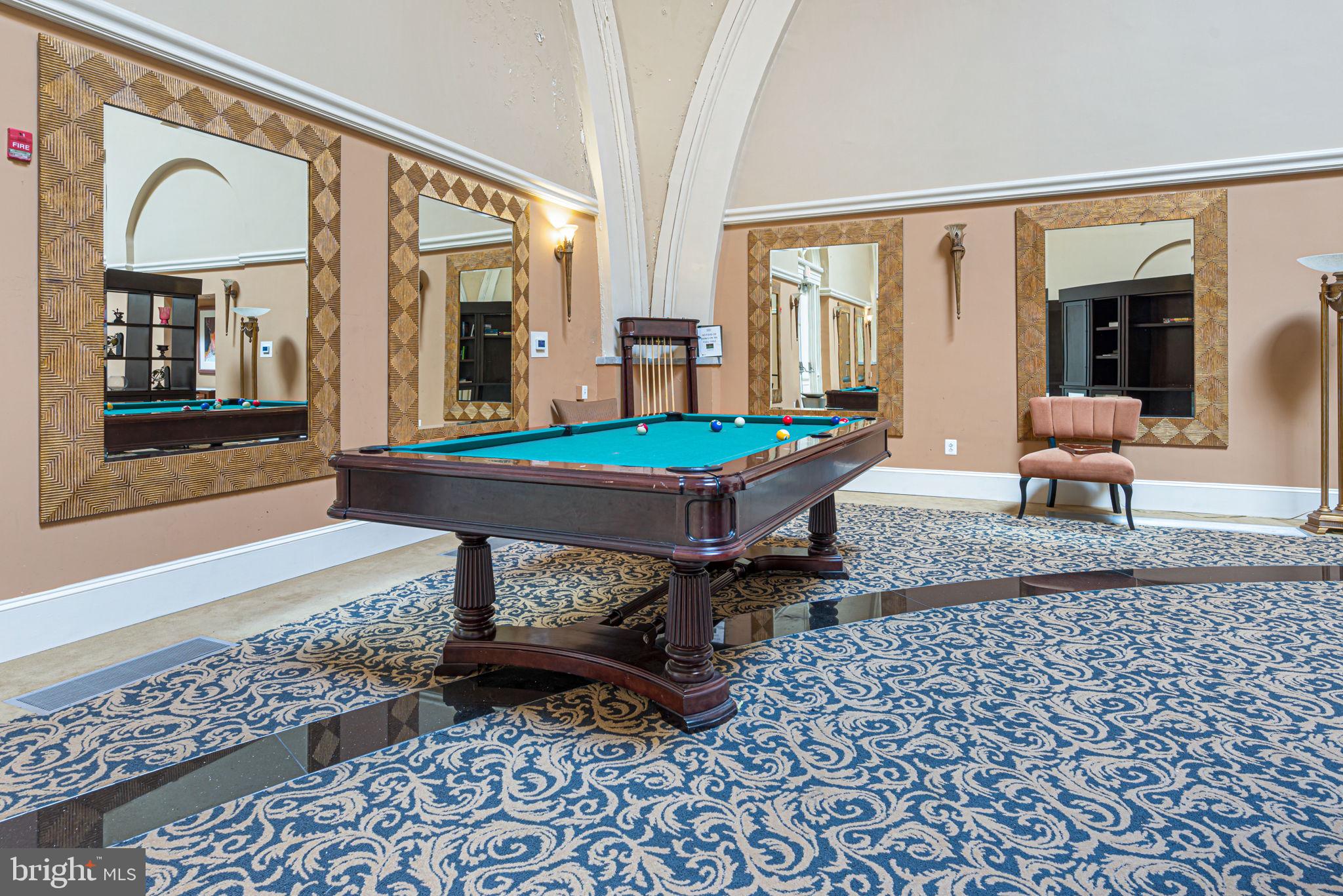 1 Academy Circle, Unit 204 Philadelphia, PA 19146 - Photo 22 of 26 Elegant game room with mirrored accents.