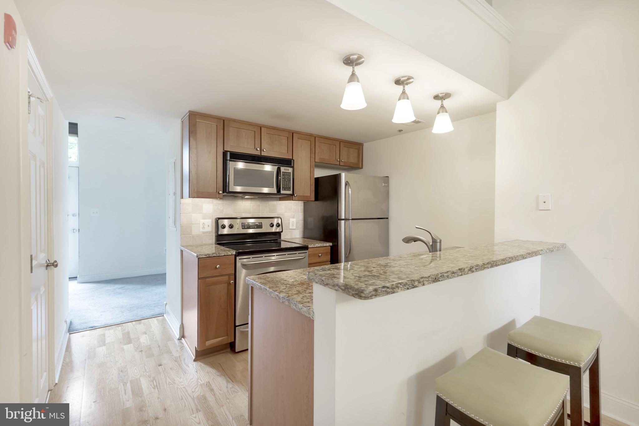 1 Academy Circle, Unit 204 Philadelphia, PA 19146 - Photo 7 of 26 Modern kitchen with sleek finishes.