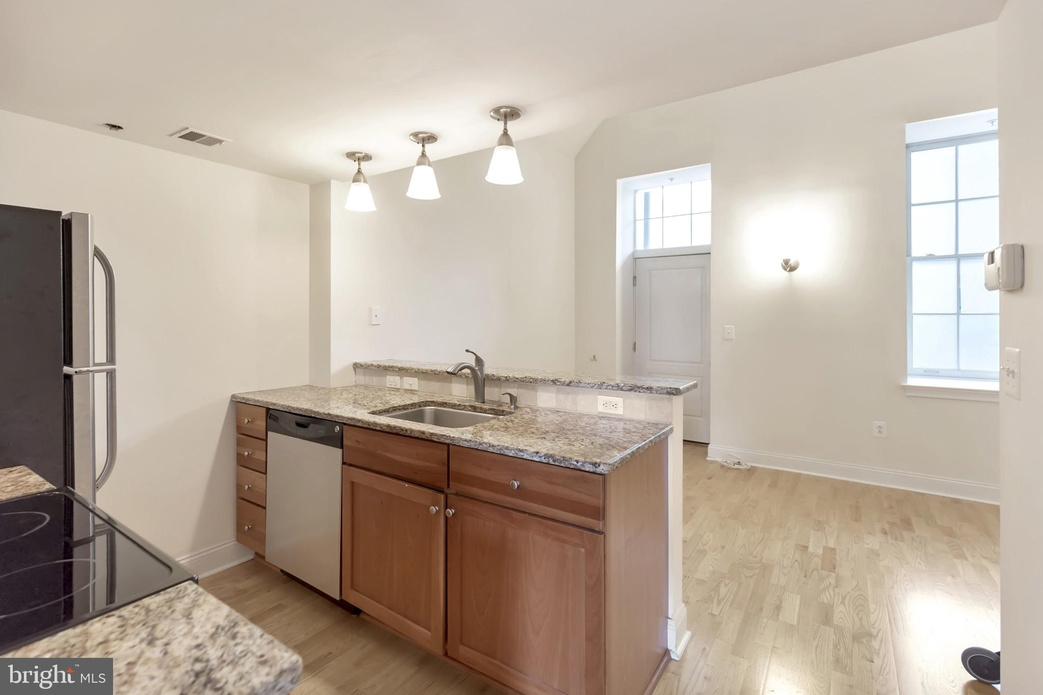 1 Academy Circle, Unit 204 Philadelphia, PA 19146 - Photo 10 of 26 Modern kitchen with natural light.