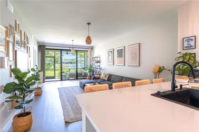 a bedroom with furniture and a large window