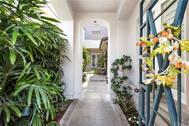an entryway with flower in front of it