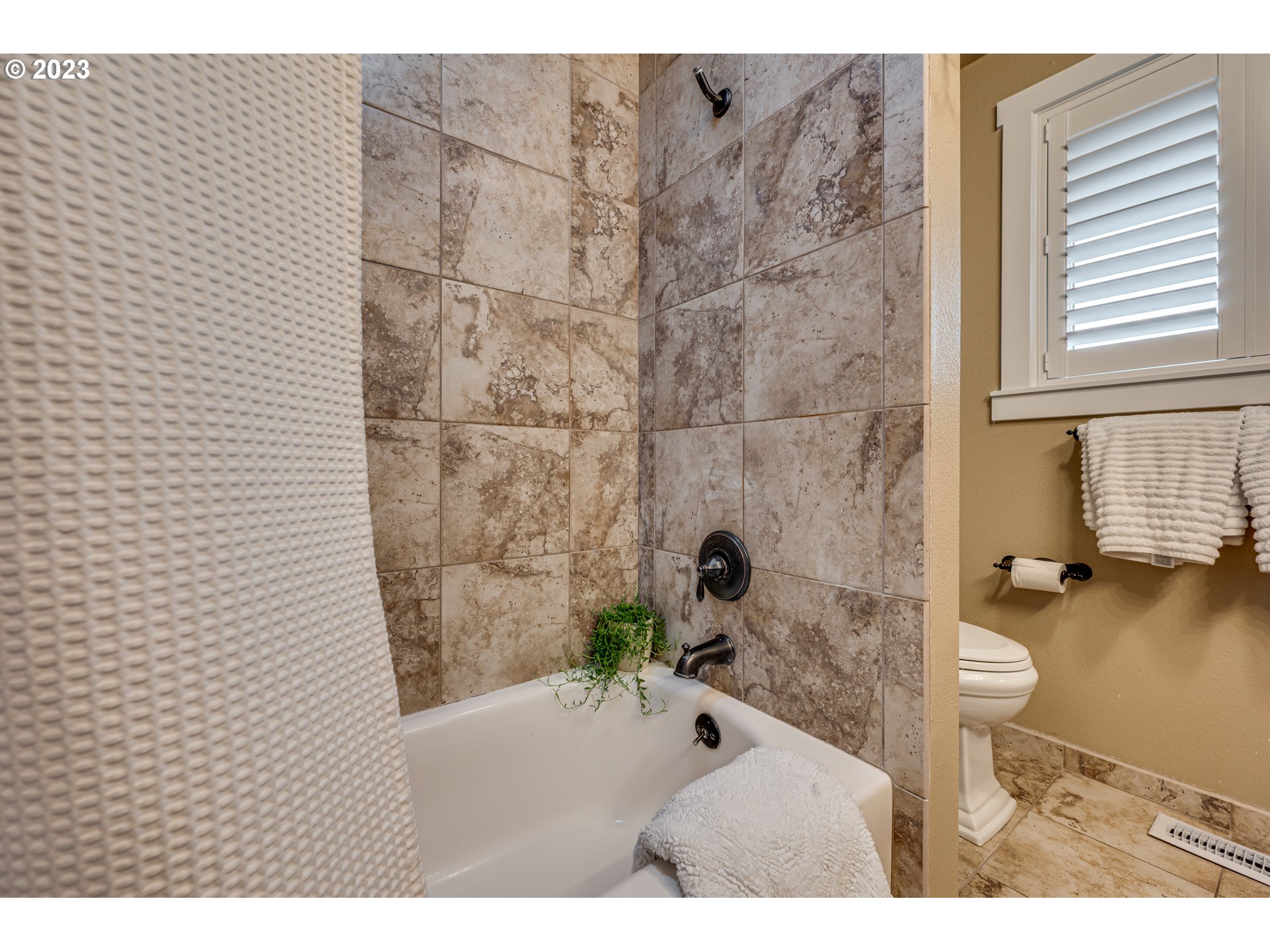 18721 Northeast Cramer Road Battle Ground, WA 98604 - Photo 17 of 32 a bathroom with a bathtub and a shower