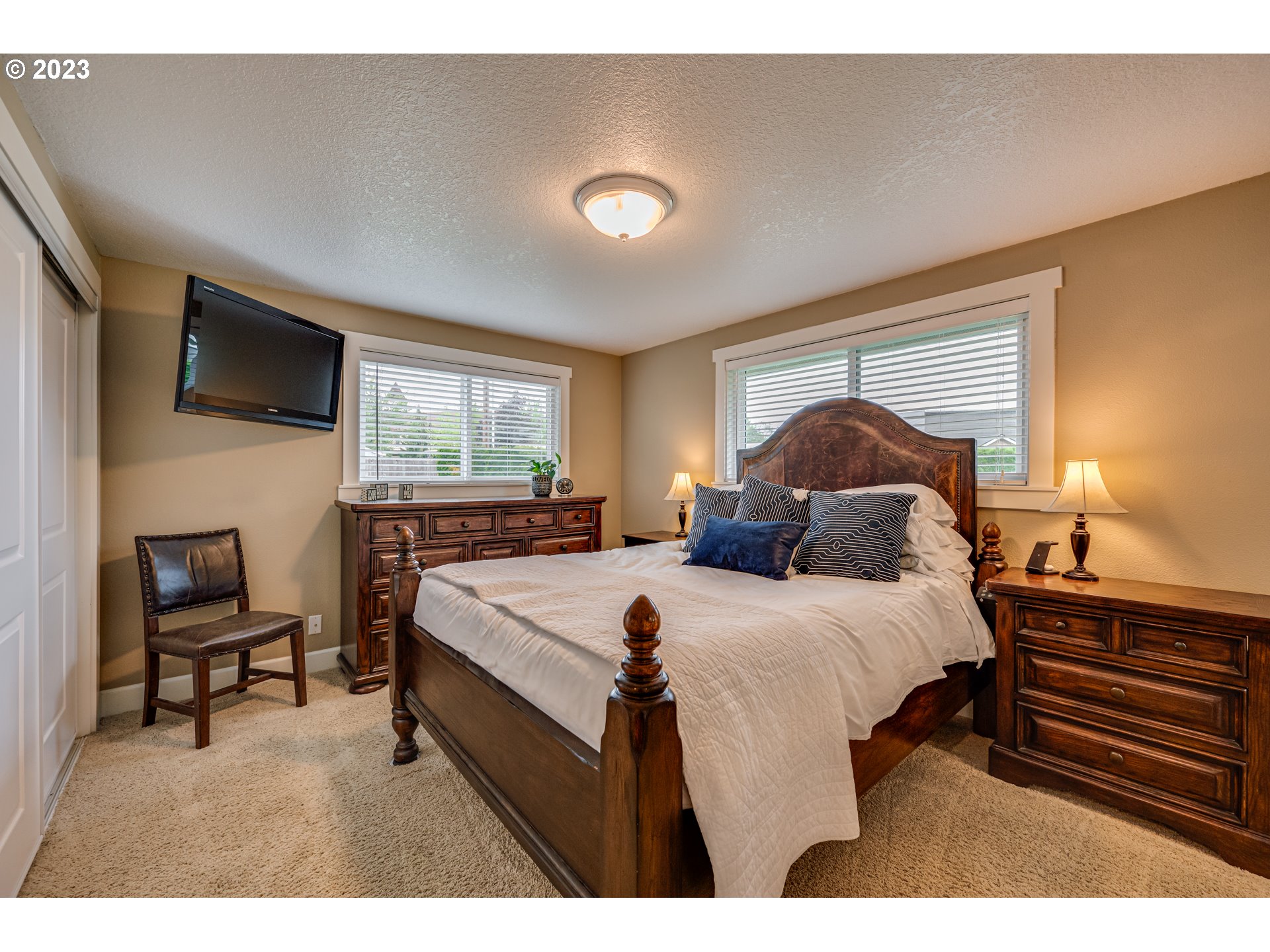 18721 Northeast Cramer Road Battle Ground, WA 98604 - Photo 20 of 32 a bed room with a bed and a television