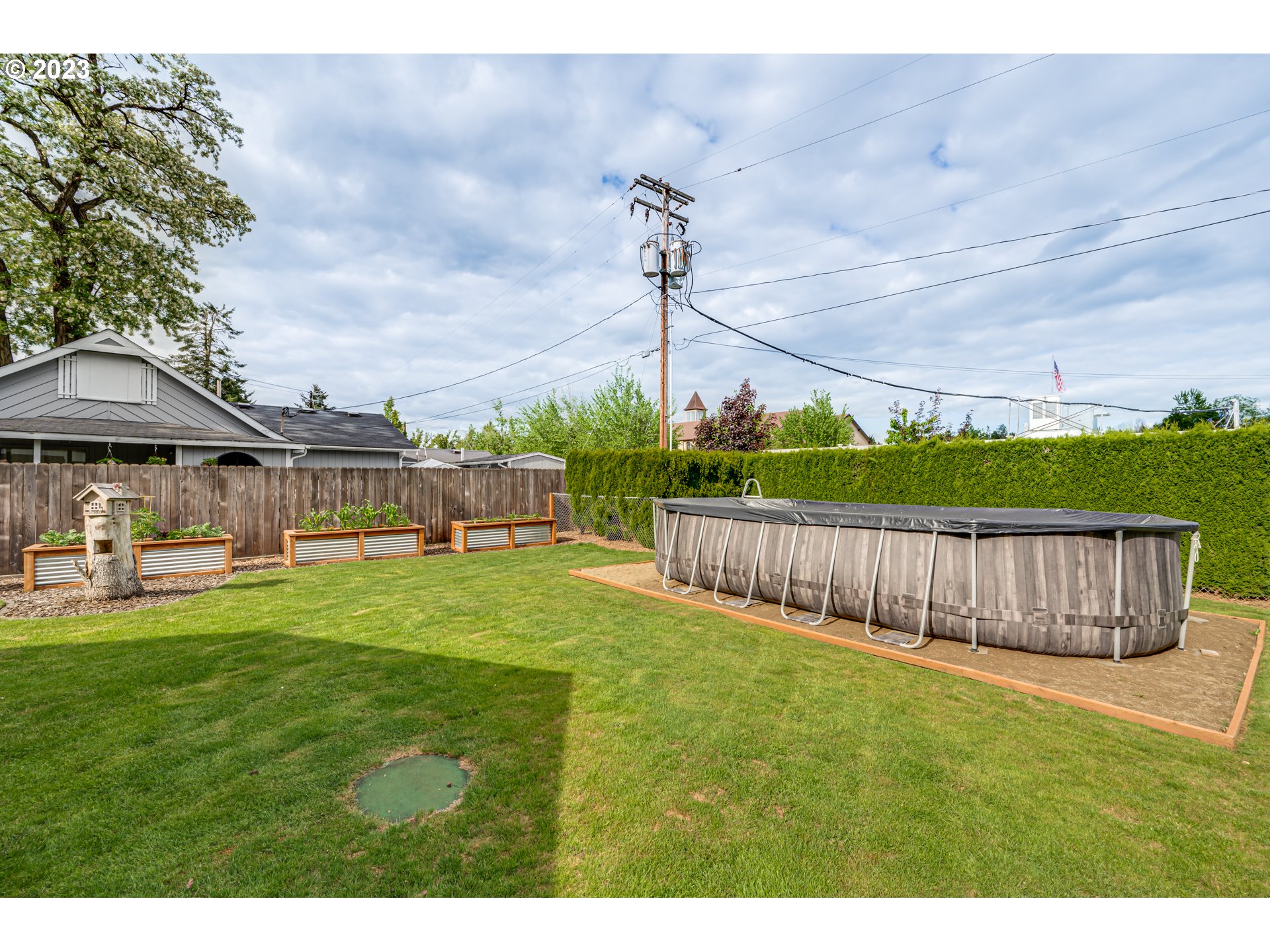 18721 Northeast Cramer Road Battle Ground, WA 98604 - Photo 25 of 32 a view of a yard with wooden fence