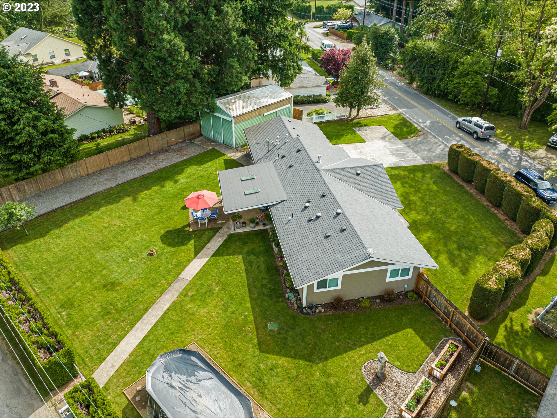 18721 Northeast Cramer Road Battle Ground, WA 98604 - Photo 31 of 32 an aerial view of a house with swimming pool lawn chairs and a yard