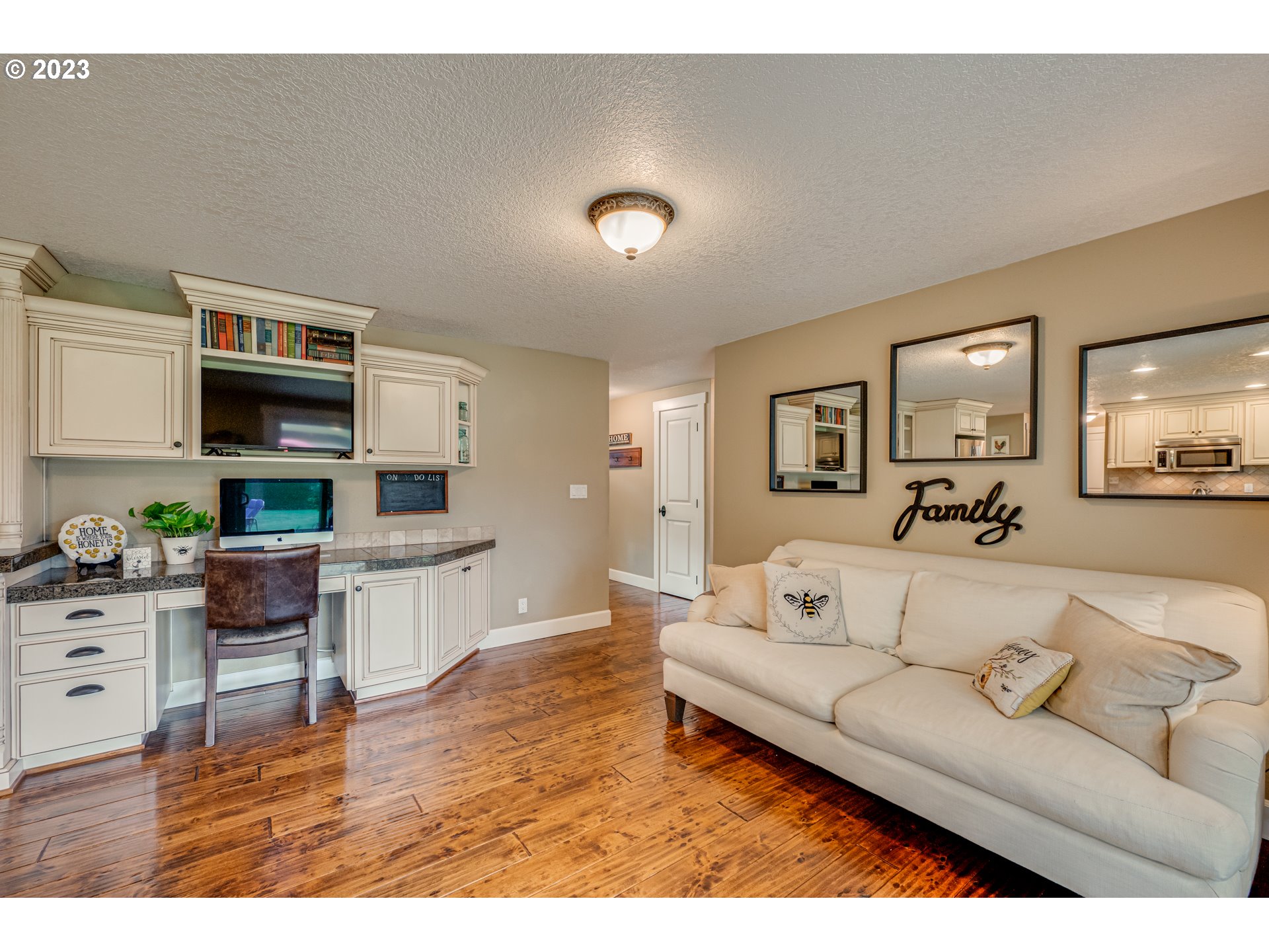 18721 Northeast Cramer Road Battle Ground, WA 98604 - Photo 8 of 32 a living room with furniture and a wooden floor