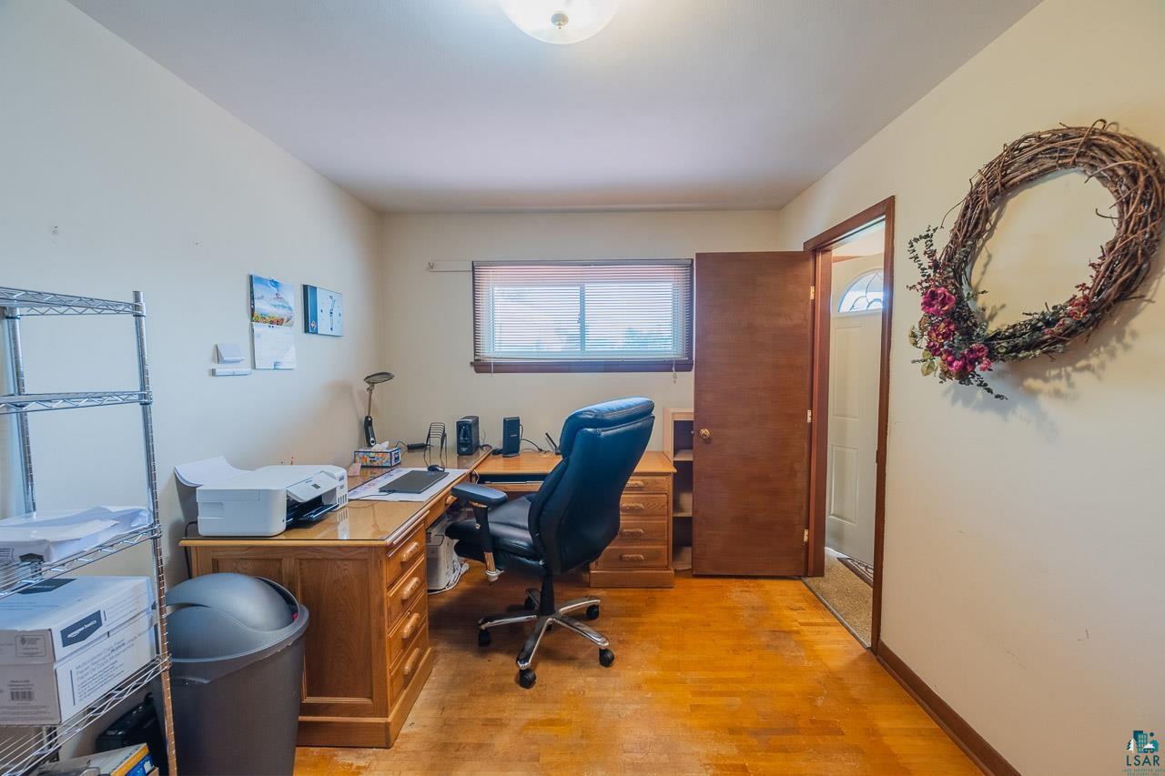 101 2nd Avenue North Biwabik, MN 55708 - Photo 19 of 44 Light-toned walls complement wood-finish flooring