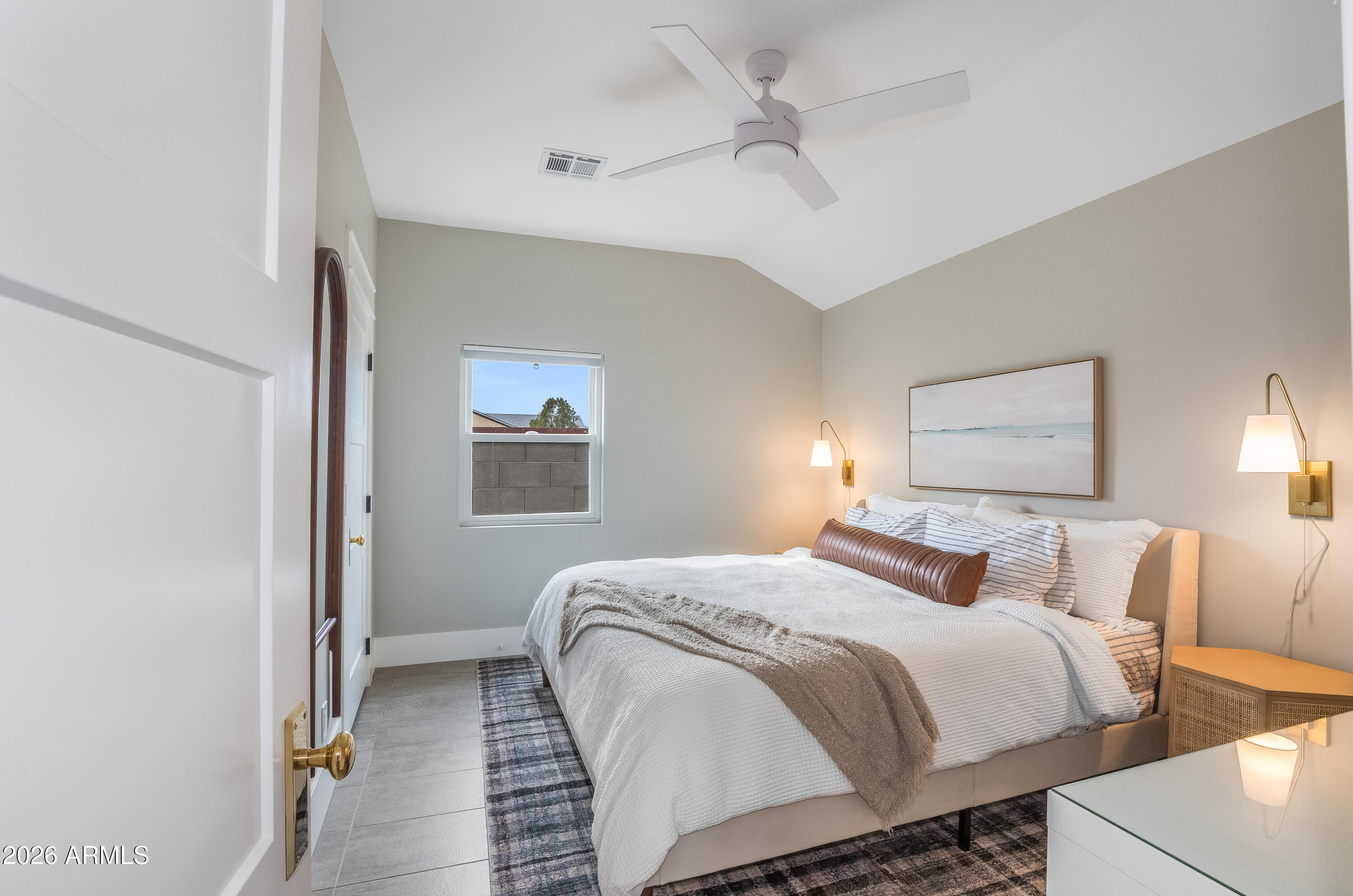 2549 North Mitchell Street Phoenix, AZ 85006 - Photo 16 of 41 a bedroom with a bed and a chandelier