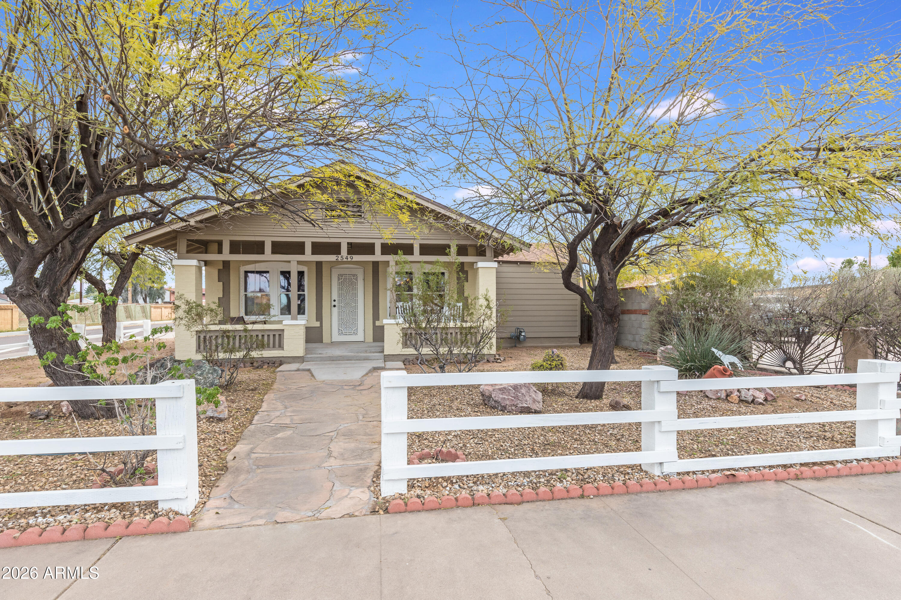 2549 North Mitchell Street Phoenix, AZ 85006 - Photo 2 of 41 a view of a white house with a large tree