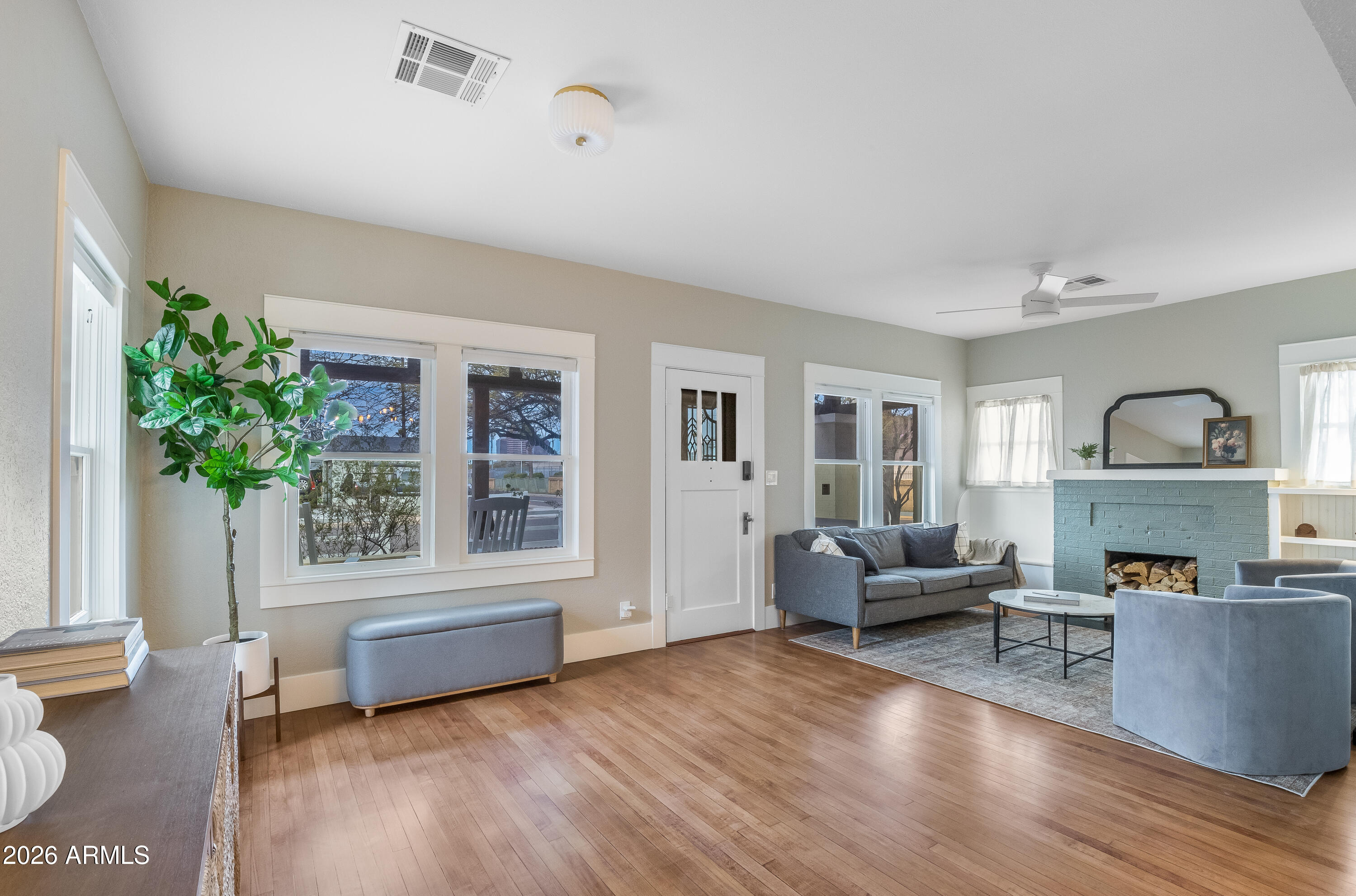 2549 North Mitchell Street Phoenix, AZ 85006 - Photo 7 of 41 a living room with furniture and a fireplace