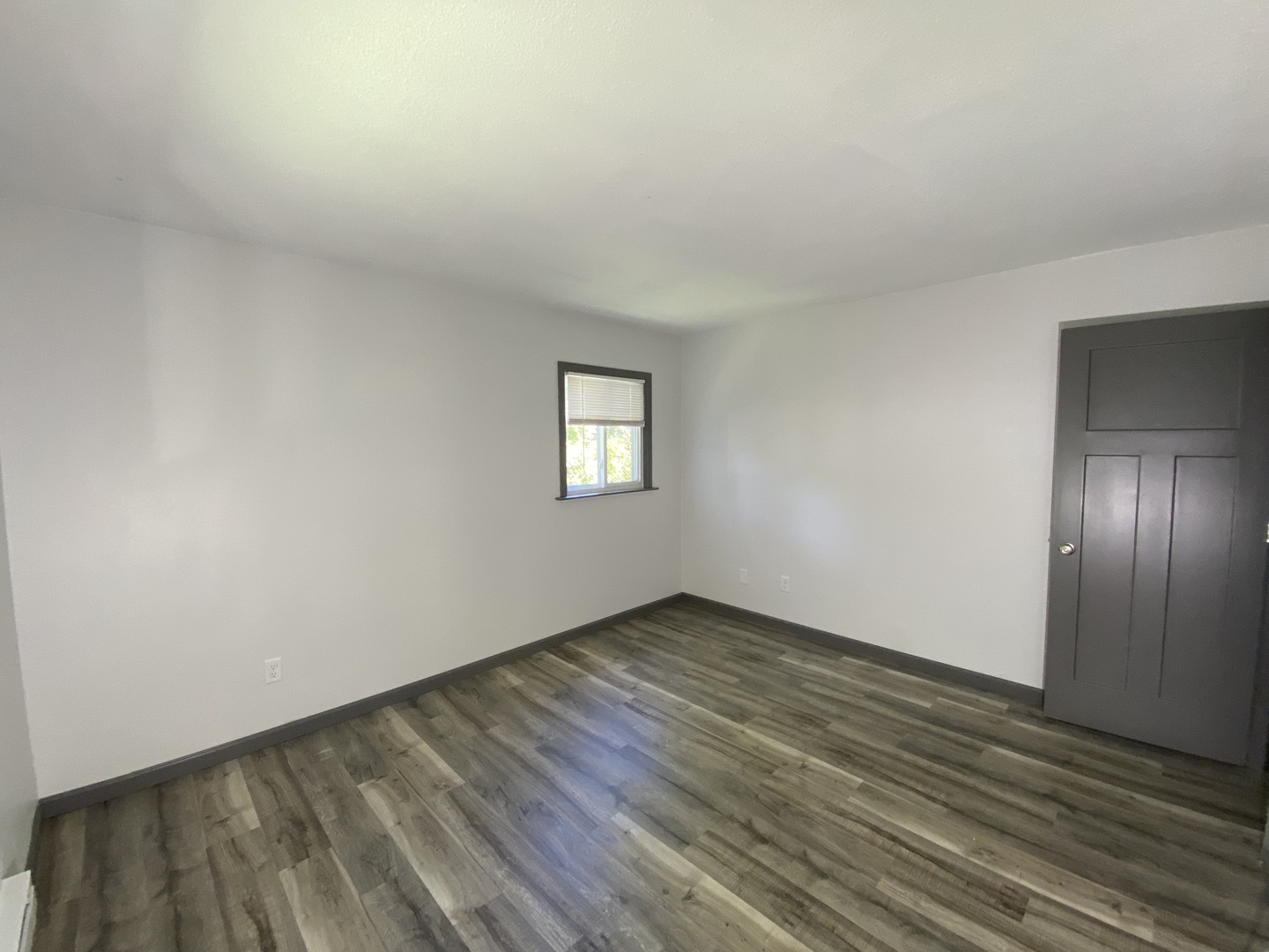901 Walnut Avenue Dixon, IL 61021 - Photo 12 of 15 an empty room with wooden floor and windows