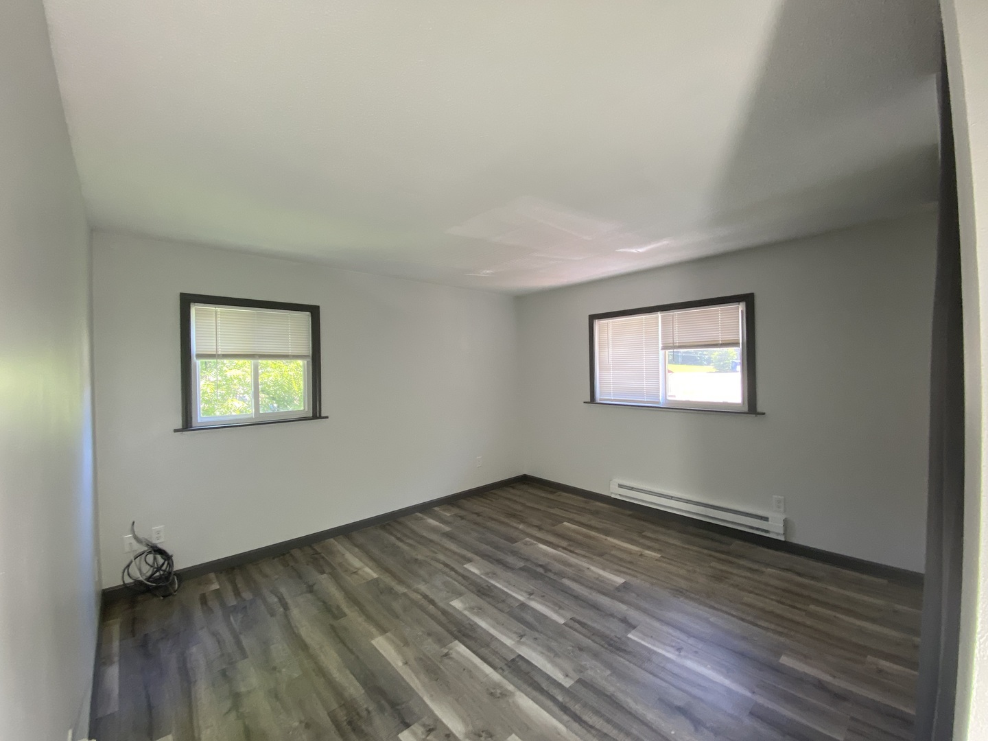 901 Walnut Avenue Dixon, IL 61021 - Photo 13 of 15 an empty room with wooden floor and windows
