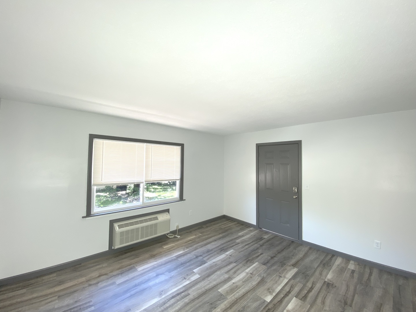 901 Walnut Avenue Dixon, IL 61021 - Photo 6 of 15 an empty room with wooden floor and windows