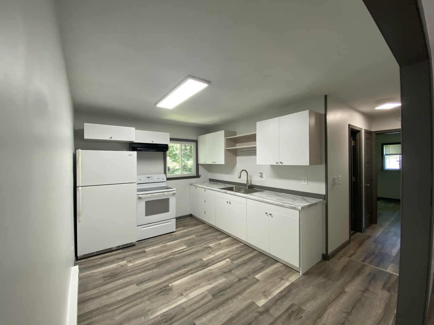901 Walnut Avenue Dixon, IL 61021 - Photo 9 of 15 a kitchen with white cabinets and white appliances