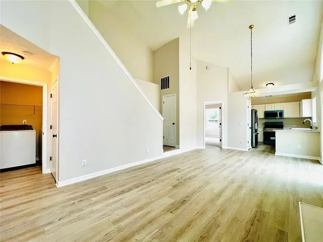 a view of a kitchen with a sink and a kitchen view