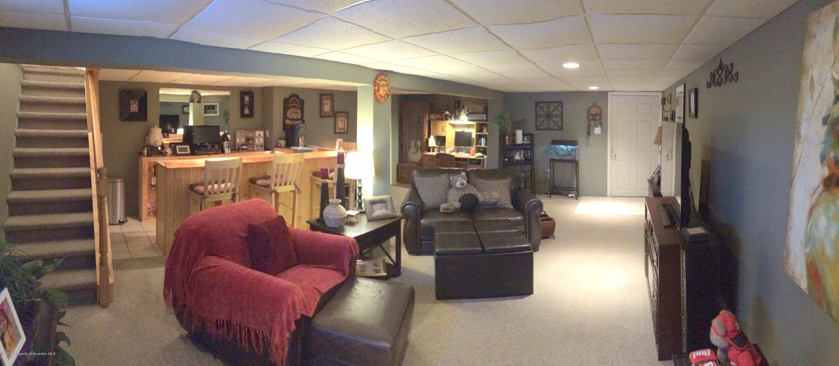 131 Shadetree Road Shavertown, PA 18708 - Photo 8 of 23 a living room with furniture a lamp and a window