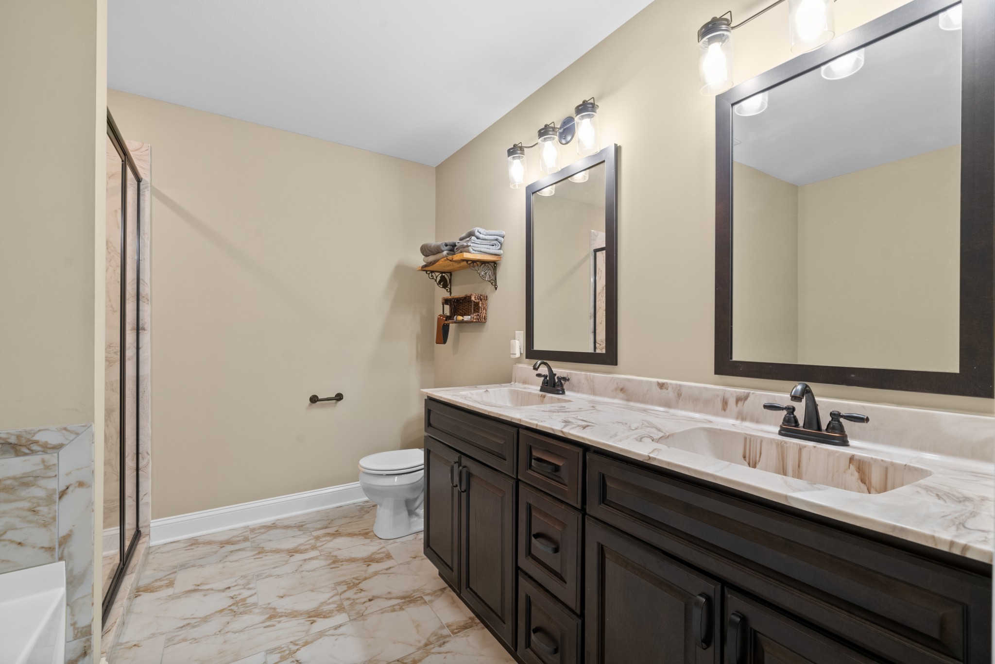 4406 Memory Lane Adams, TN 37010 - Photo 19 of 36 a bathroom with a double vanity sink toilet and mirror