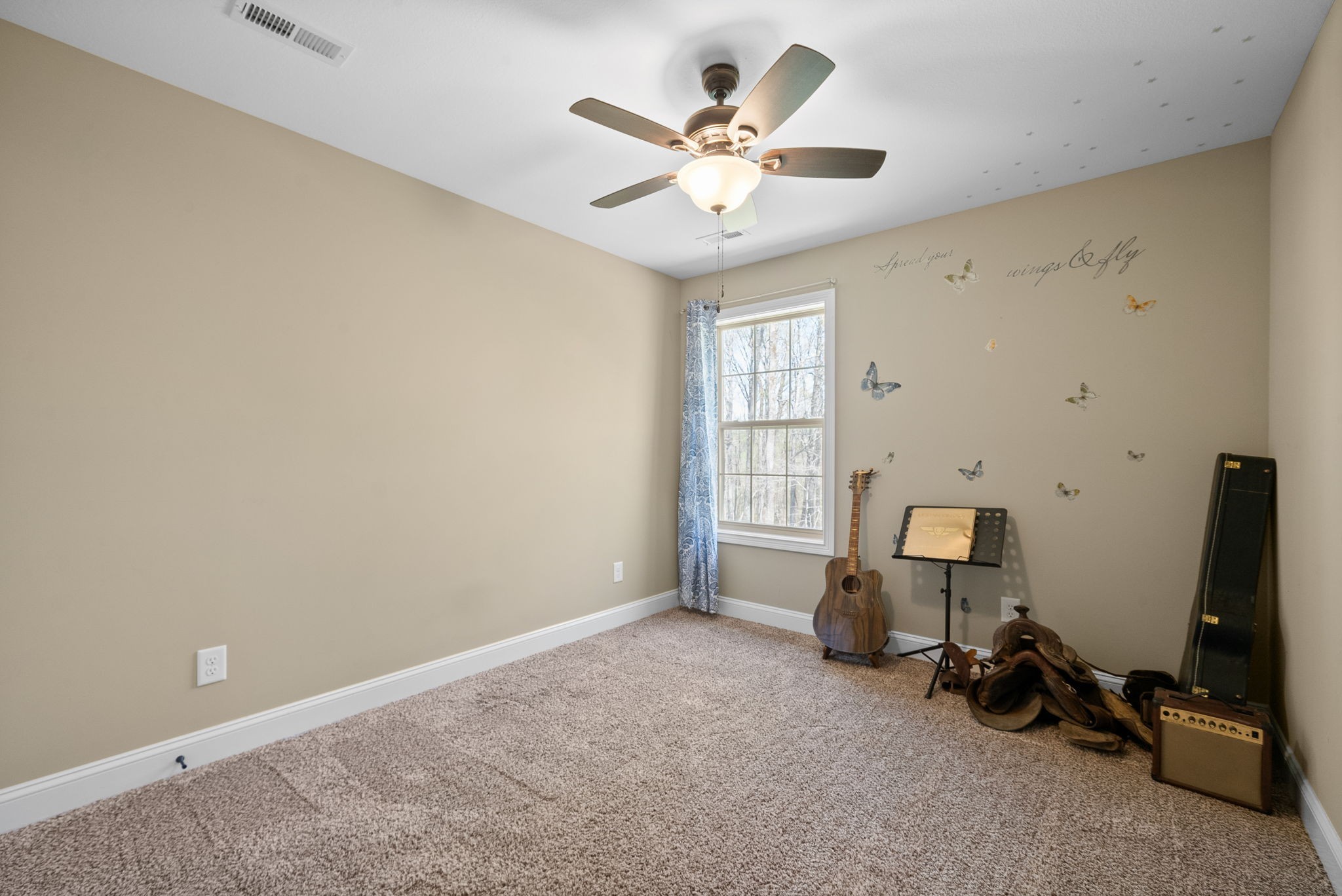 4406 Memory Lane Adams, TN 37010 - Photo 24 of 36 an empty room with windows and ceiling fan