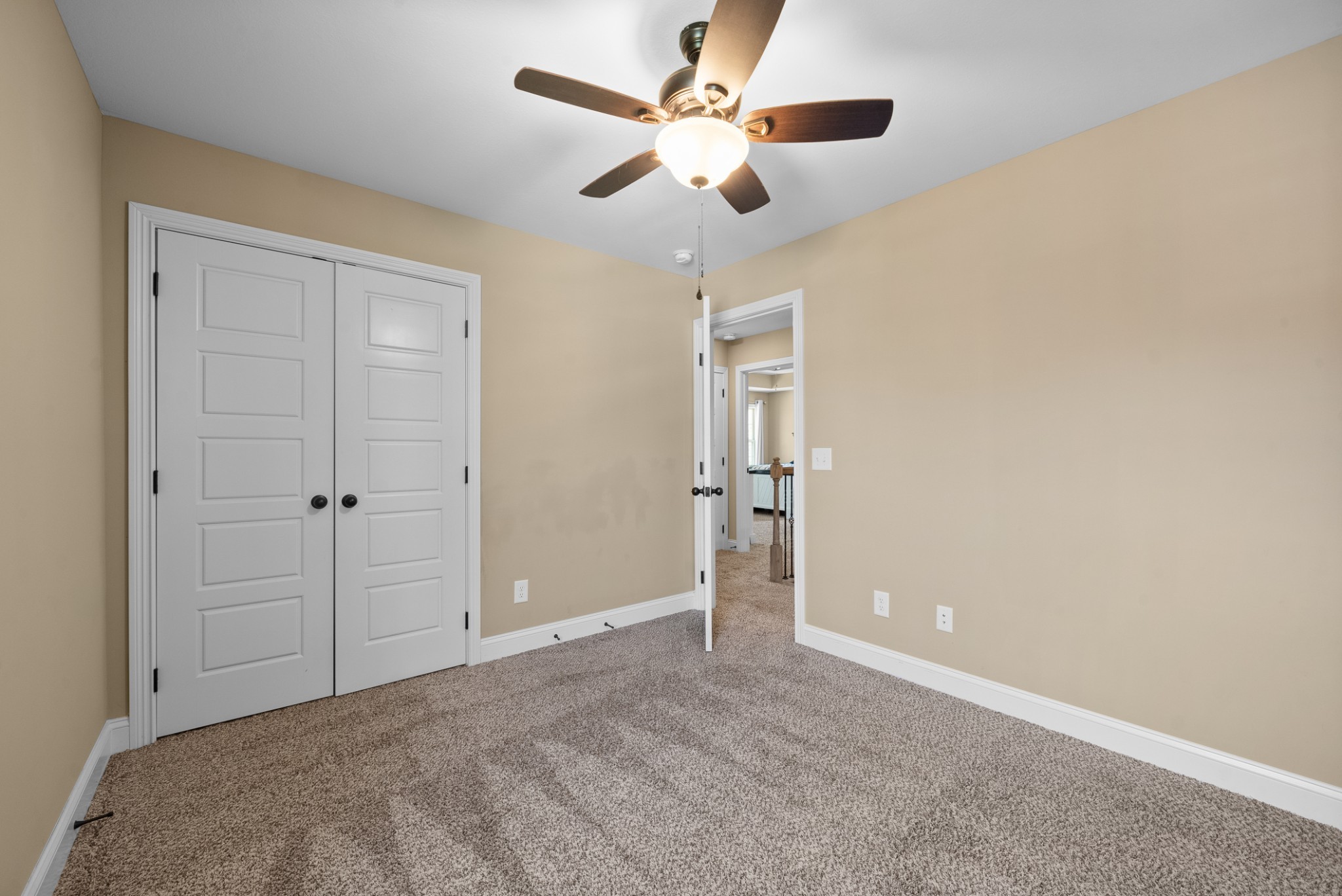 4406 Memory Lane Adams, TN 37010 - Photo 25 of 36 an empty room with closet and a ceiling fan
