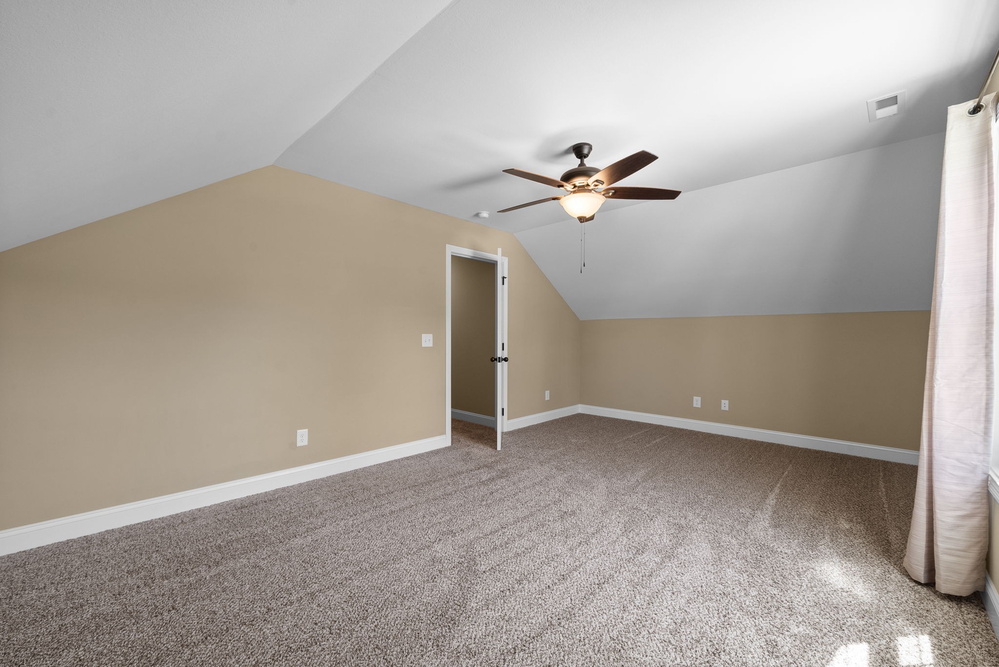 4406 Memory Lane Adams, TN 37010 - Photo 27 of 36 an empty room with closet and a chandelier fan