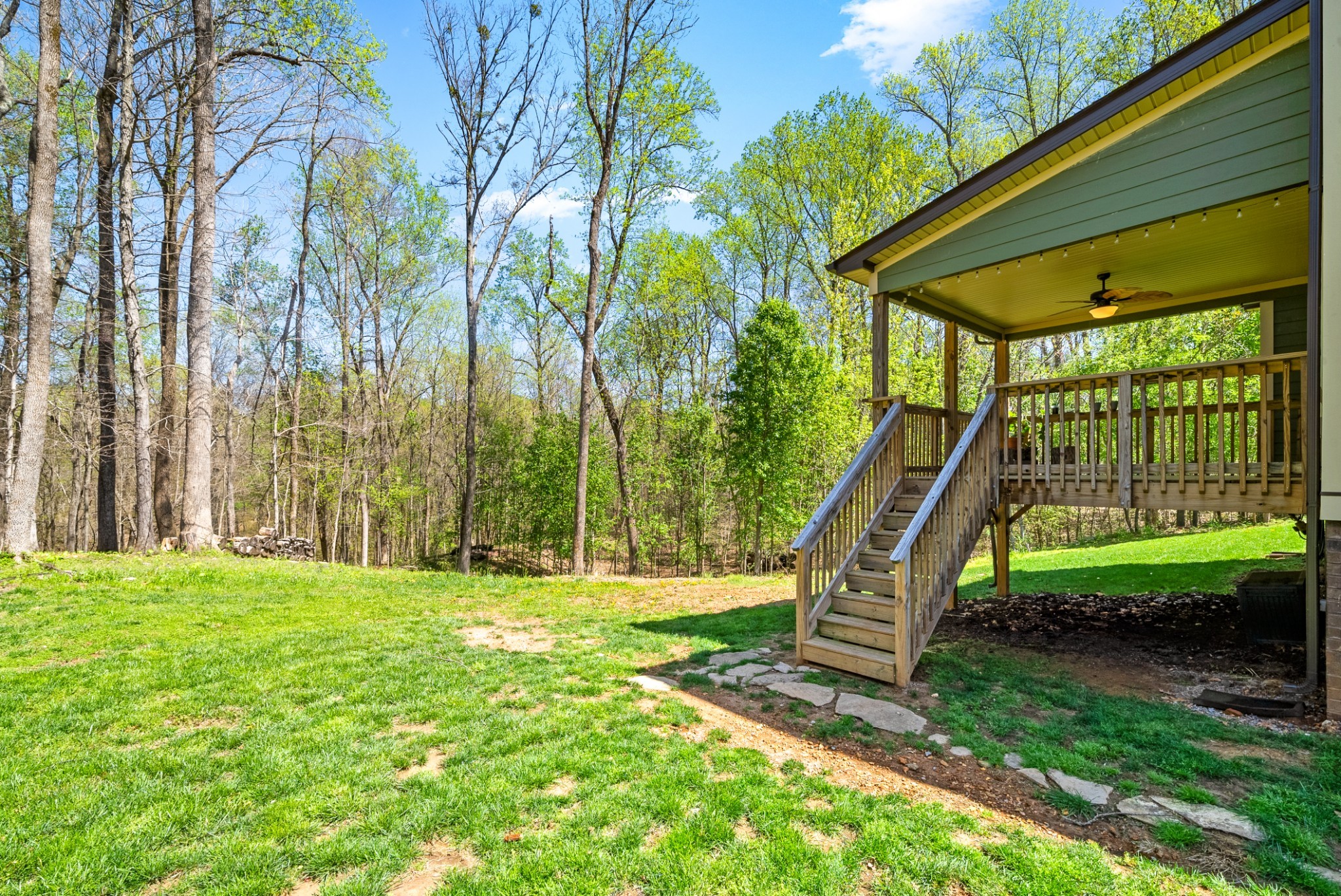 4406 Memory Lane Adams, TN 37010 - Photo 29 of 36 a backyard of a house with a yard and outdoor seating