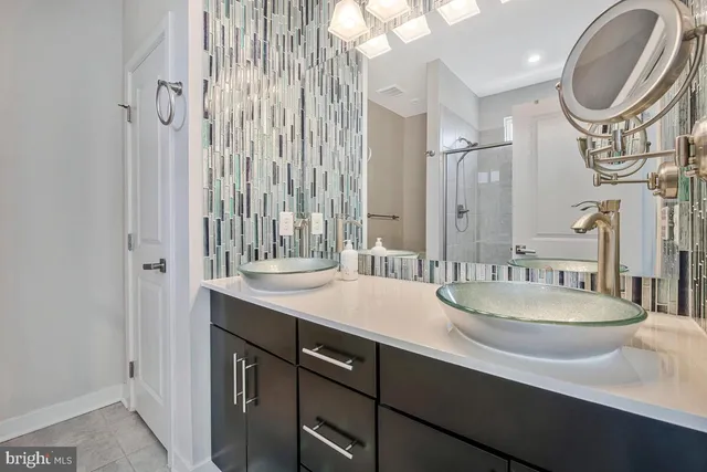 a bathroom with a glass shower door
