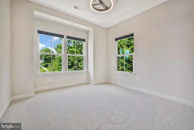 an empty room with windows