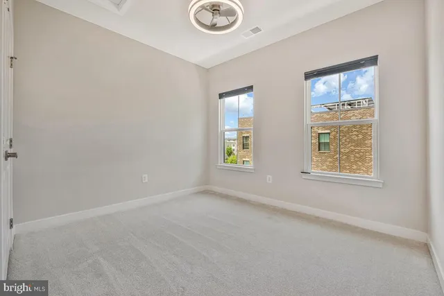 an empty room with closet area