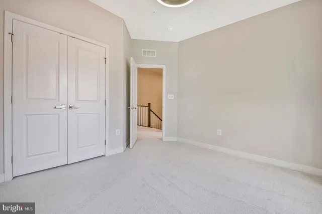 a bathroom with a sink a toilet a mirror a vanity and bathtub