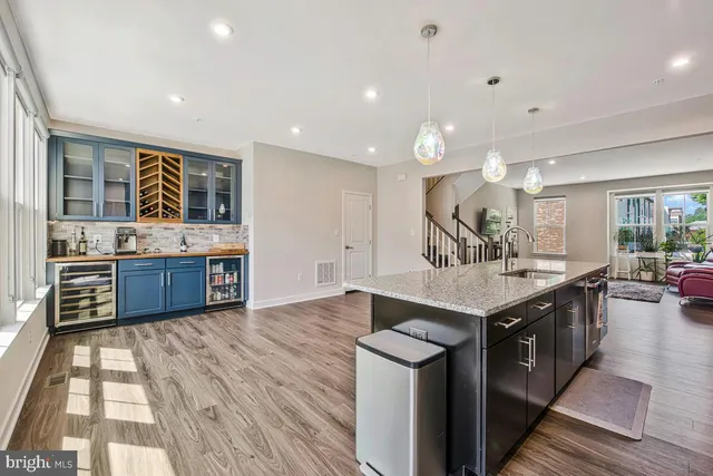 a kitchen with stainless steel appliances a sink and cabinets