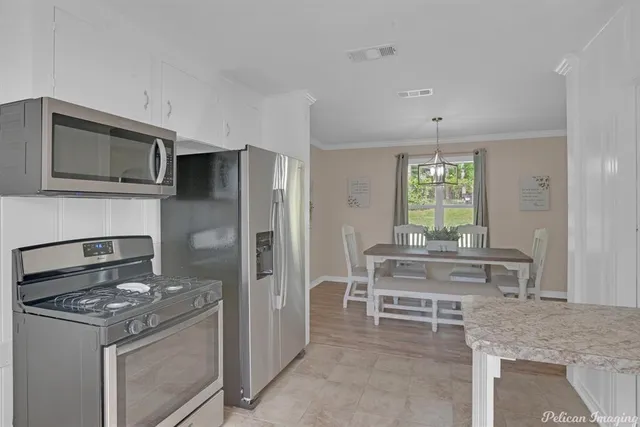 a kitchen with a stove and a microwave