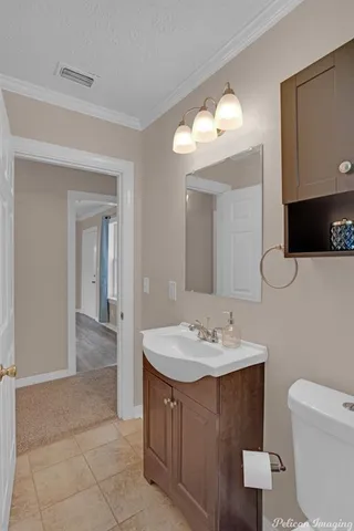 a bathroom with a sink vanity and mirror
