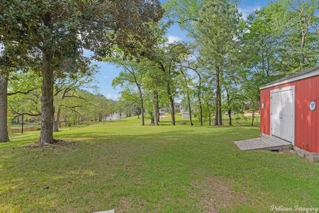 a view of field with trees in the background