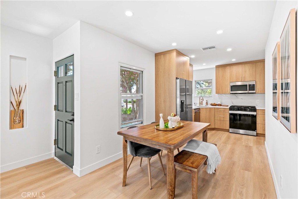 2105 N Pass Burbank, CA 91505 - Photo 11 of 31 a kitchen with a table chairs refrigerator and cabinets