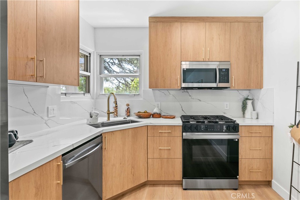 2105 N Pass Burbank, CA 91505 - Photo 16 of 31 a kitchen with a sink stove and microwave
