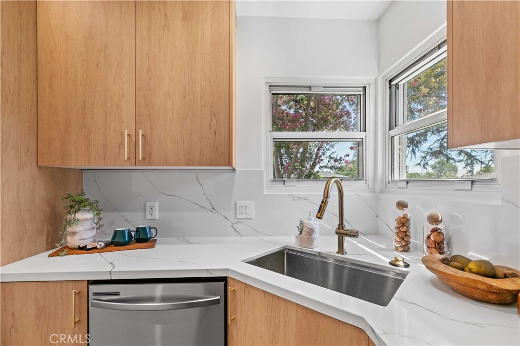 2105 N Pass Burbank, CA 91505 - Photo 18 of 31 a kitchen with stainless steel appliances granite countertop a sink and a white cabinets