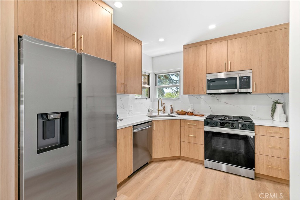2105 N Pass Burbank, CA 91505 - Photo 19 of 31 a kitchen with stainless steel appliances granite countertop a stove a refrigerator and a microwave