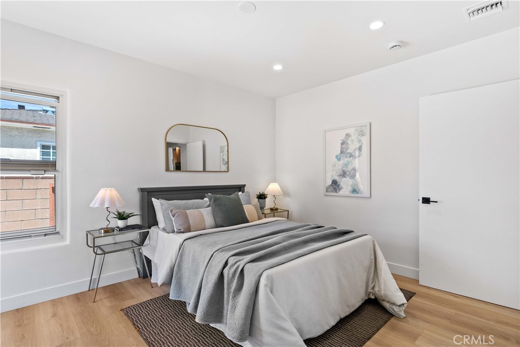 2105 N Pass Burbank, CA 91505 - Photo 23 of 31 a bedroom with a bed and a window