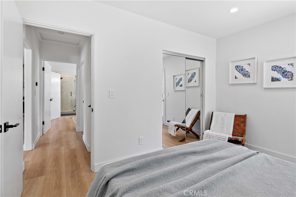 2105 N Pass Burbank, CA 91505 - Photo 24 of 31 a bedroom with a bed and wooden floor