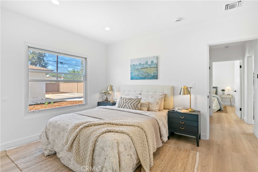 2105 N Pass Burbank, CA 91505 - Photo 28 of 31 a bedroom with a bed and wooden floor