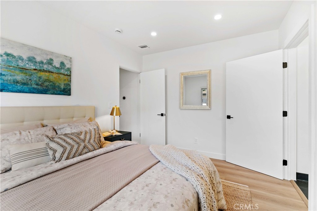 2105 N Pass Burbank, CA 91505 - Photo 29 of 31 a bedroom with a bed and a couch