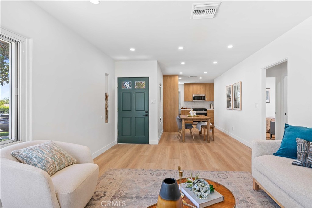 2105 N Pass Burbank, CA 91505 - Photo 9 of 31 a living room with furniture and a table with wooden floor