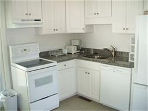 31 Hy Road Westminster, MA 01473 - Photo 3 of 10 a kitchen with granite countertop white cabinets and white appliances