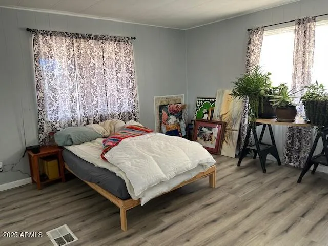 a bedroom with a bed and a chair
