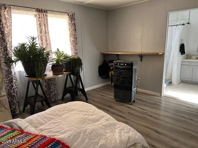 a bed room with a bed and a chair