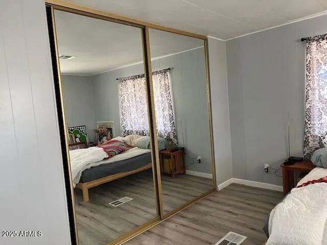 a bedroom with a bed and a window with the outer view