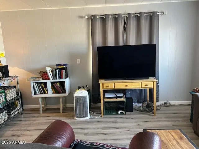 a view of livingroom with furniture and a flat screen tv