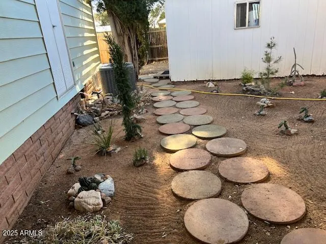 a view of a house with wooden floor and a large tree